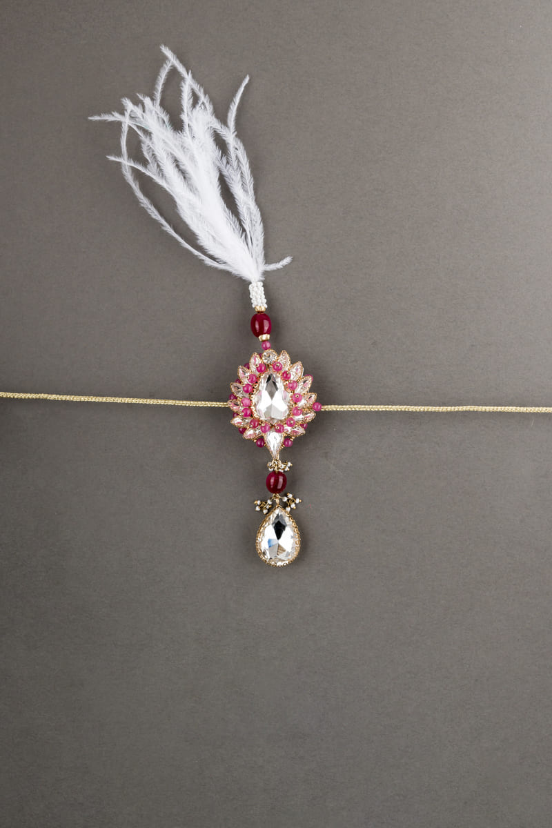 Red Pearl Crystal Drop Sarpech With Feather Detailing