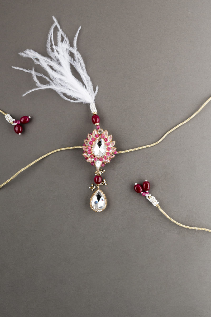 Red Pearl Crystal Drop Sarpech With Feather Detailing